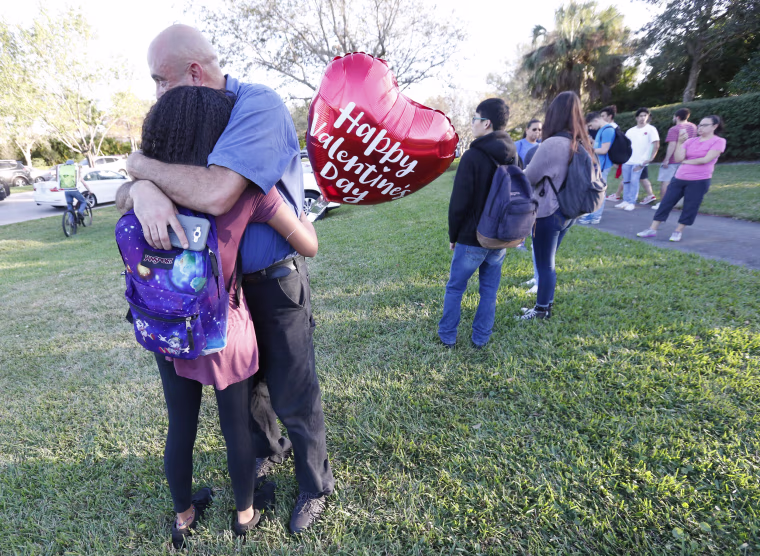Image: Family members embrace