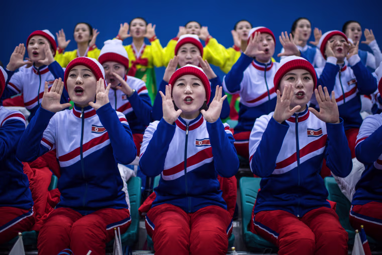 Image: North Korean cheerleaders chant during the women's ice hockey preliminary game