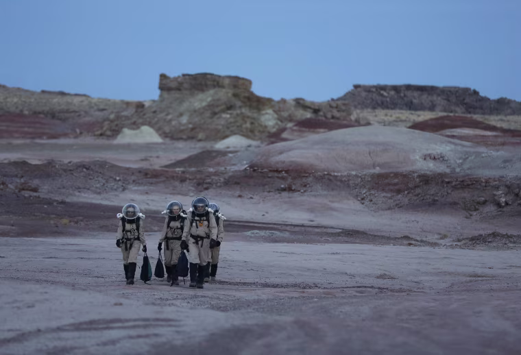 Image: Members of Crew 125 EuroMoonMars B mission return after collecting geologic samples in the Utah desert