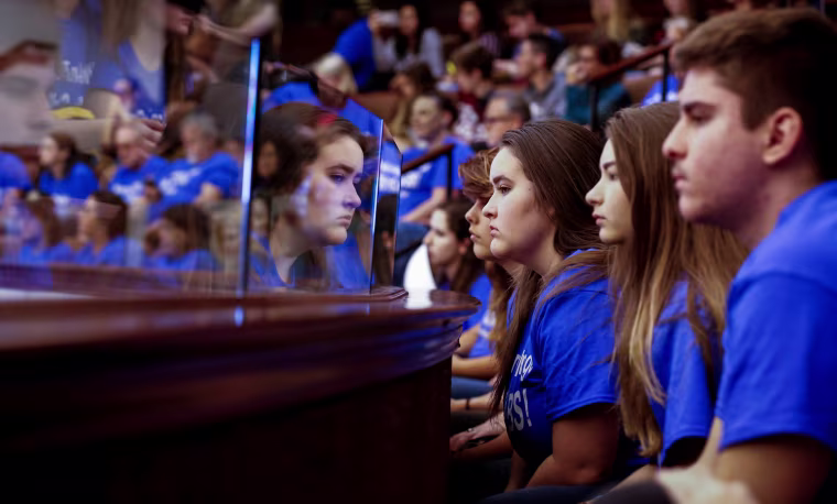 Image: Students from Marjory Stoneman Douglas High School look on from the gallery above the Florida Senate after the Senate honoured the victims of last week's mass shooting on their campus, in Tallahassee