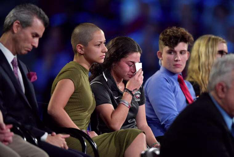 Image: Marjory Stoneman Douglas High School student Emma Gonzalez comforts a classmate during a CNN town hall meeting, at the BB&amp;T Center, in Sunrise