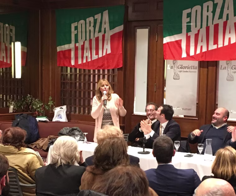 Image: Alessandro Mussolini, 55, granddaughter of Italy's wartime fascist leader Benito Mussolini, is greeted by supporters at a campaign event in Rome for Silvio Berlusconi's center-right Forza Italia party on Feb. 22. 