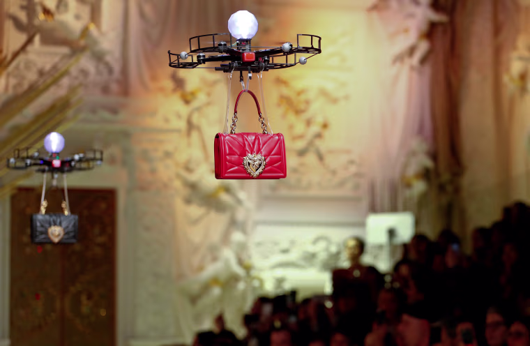Image: Drones carry bags at the Dolce & Gabbana Autumn/Winter 2018 women's collection