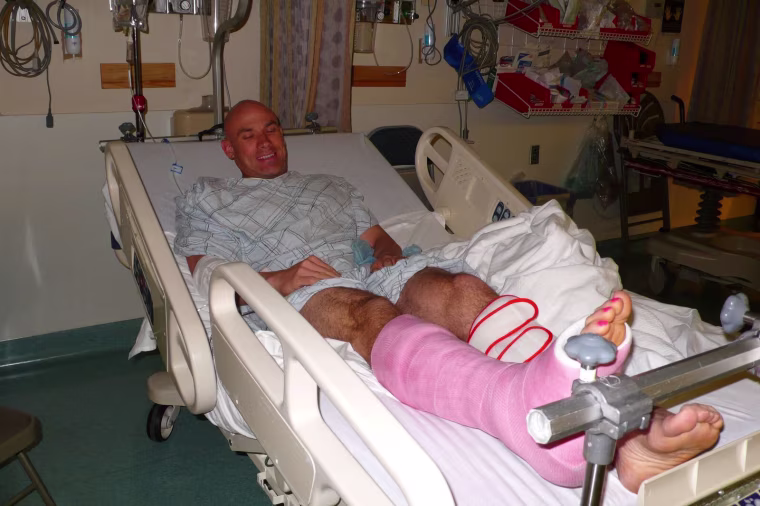 Donald smiles with his pink cast in a hospital in New York.