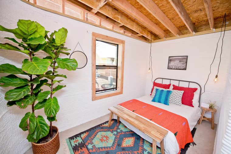 Image: A bedroom inside a home made with a giant 3D printer