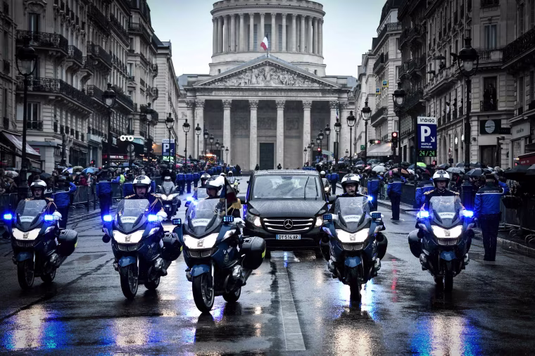 Image: French gendarmes escort the coffin