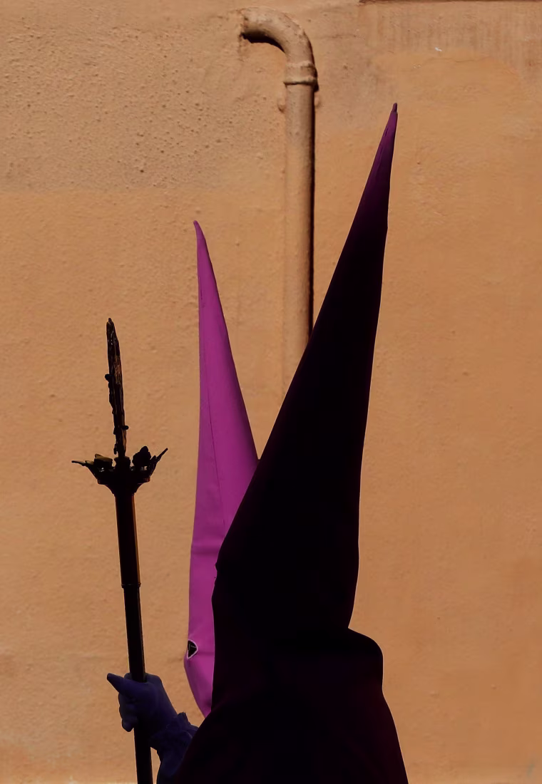 Two penitents arrive for the Maritime Holy Week procession in Valencia, eastern Spain on March 30. The Easter week tradition dates back to the 15th century, and is unique to the port city of Valencia.