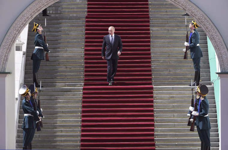 Image: Vladimir Putin leaves following his inauguration ceremony for his fourth term as Russia's president
