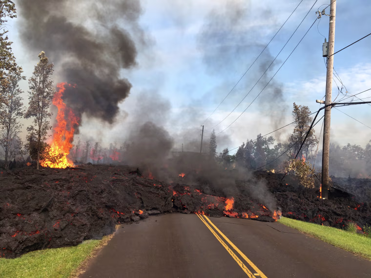 Image: Lava advances along a street near a fissure in Leilani Estates, on Kilauea Volcano's lower East Rift Zone, Hawaii