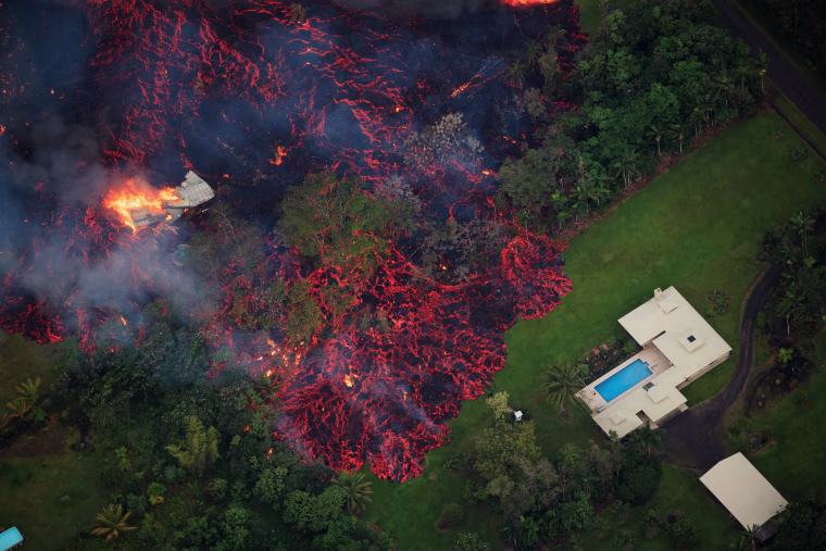Image: Lava flows into the Leilani Estates subdivision after a fissure eruption