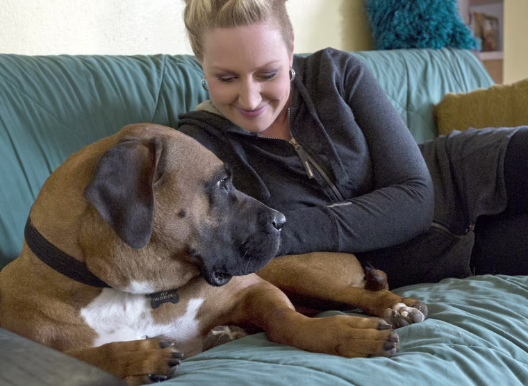 Image: Megan Watkins takes a moment to pet Florence