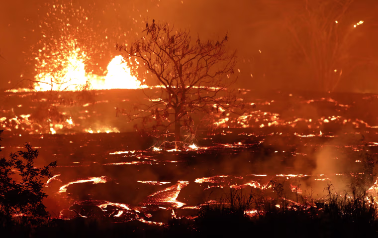 Image: Lava erupts and flows from a Kilauea volcano fissure in Kapoho
