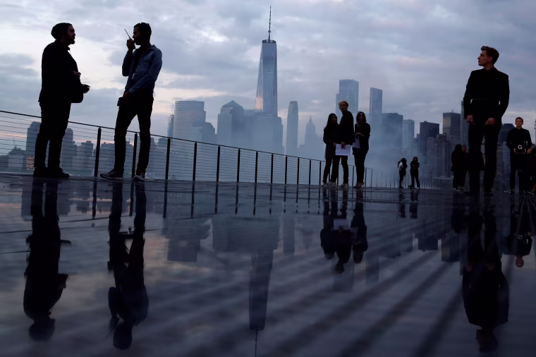 Image: The skyline of downtown Manhattan is seen as people gather on the runway before the Saint Laurent Men's Spring/Summer 2019 collection presentation in New Jersey