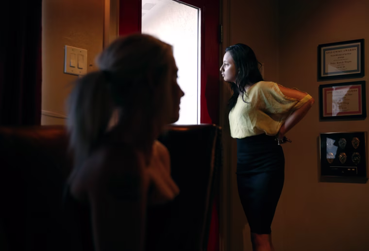 Image: Prostitutes Destini Starr, right, and Paris Envy wait for customers