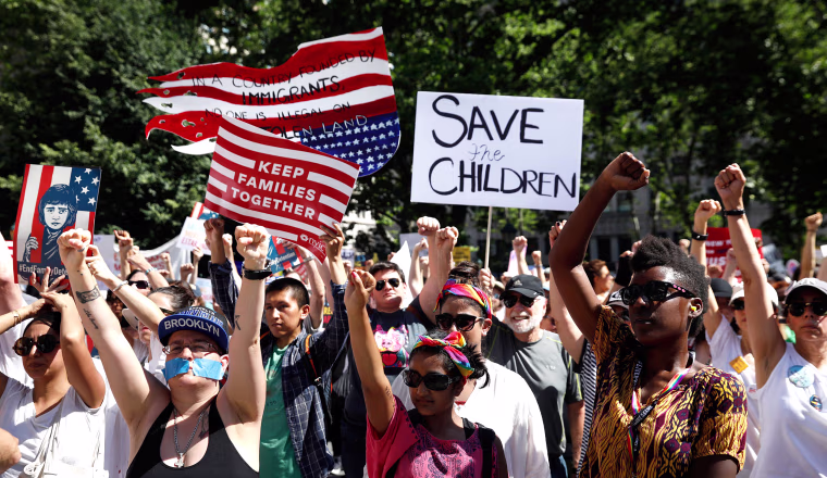Image: Demonstrators participate in \"Keep Families Together\" march to protest Trump administration's immigration policy in Manhattan New York