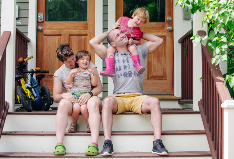 Image: The Sharpe family outside their home in Cambridge
