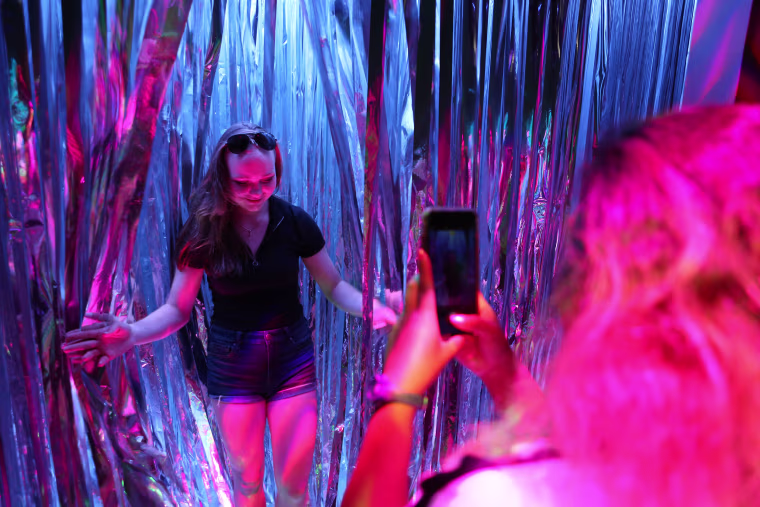 Image: Jaia Delizo takes a picture of Amanda Svensson
