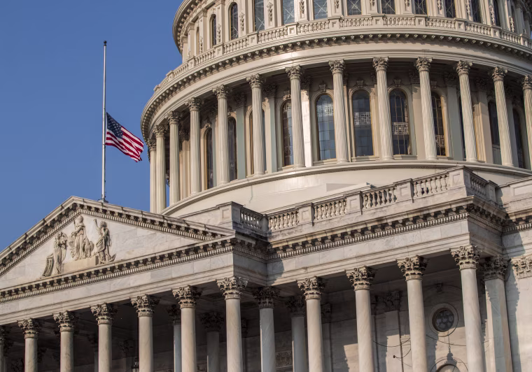 Image: The American flag flies at half-staff at the Capitol in honor of Sen. John McCain