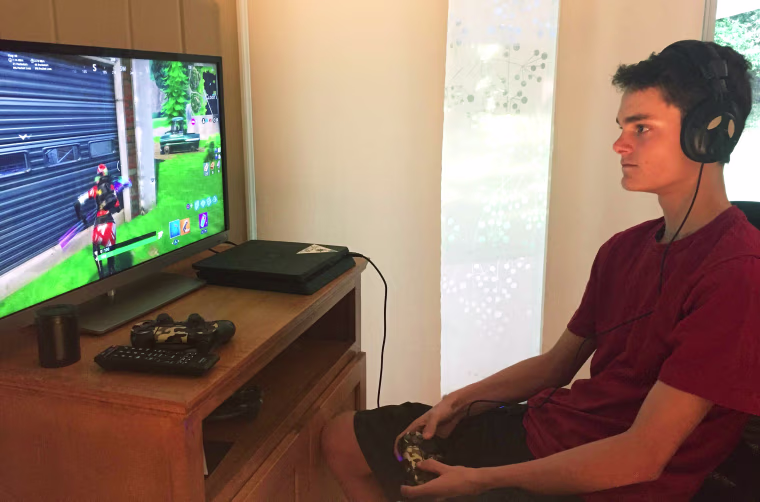 Wyatt Kosmerl, 14, playing Fortnite at his home in Avondale Estates, Georgia.