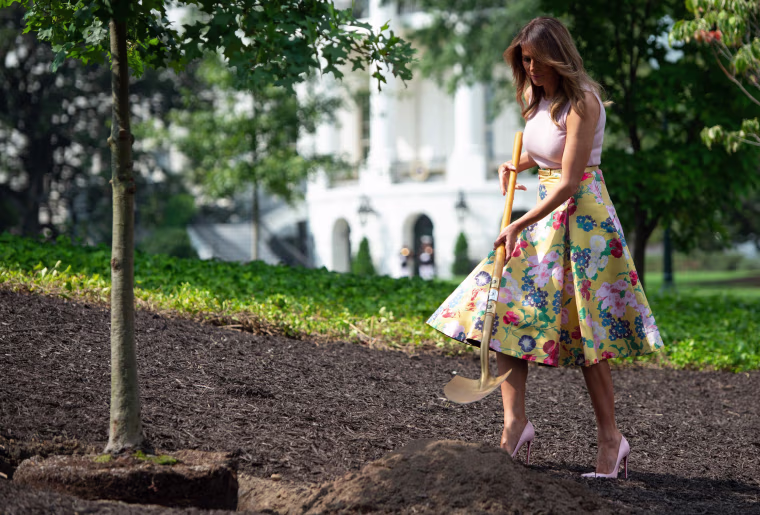 Image: First lady Melania Trump participates in a tree planting ceremony on the south grounds of the White House