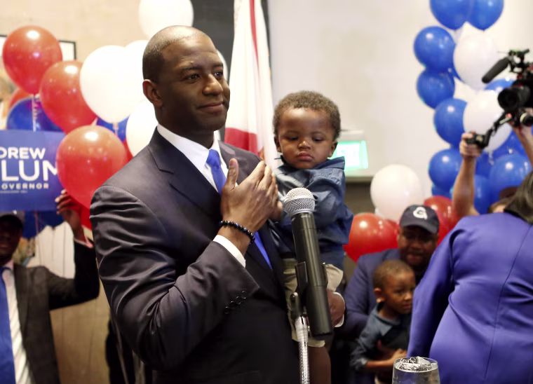 Image: Andrew Gillum holds son, Jackson