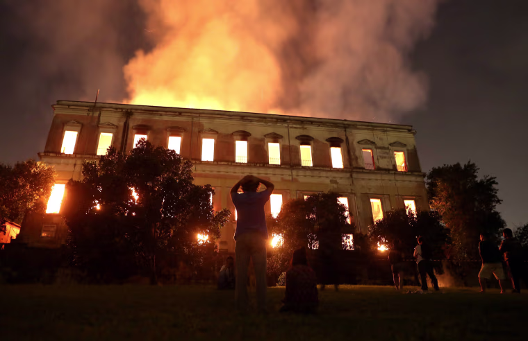 Image: People watch as a fire burns at the National Museum of Brazil in Rio de Janeiro