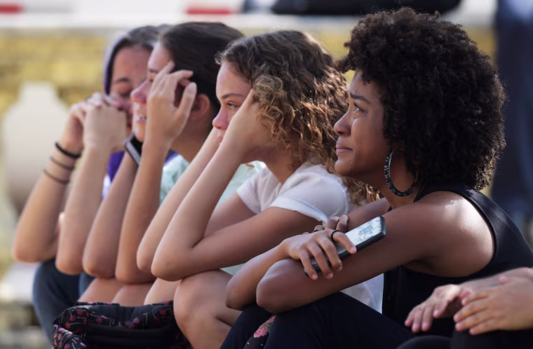 Image: Women react a day after a massive fire ripped through Brazil's National Museum in Rio de Janeiro