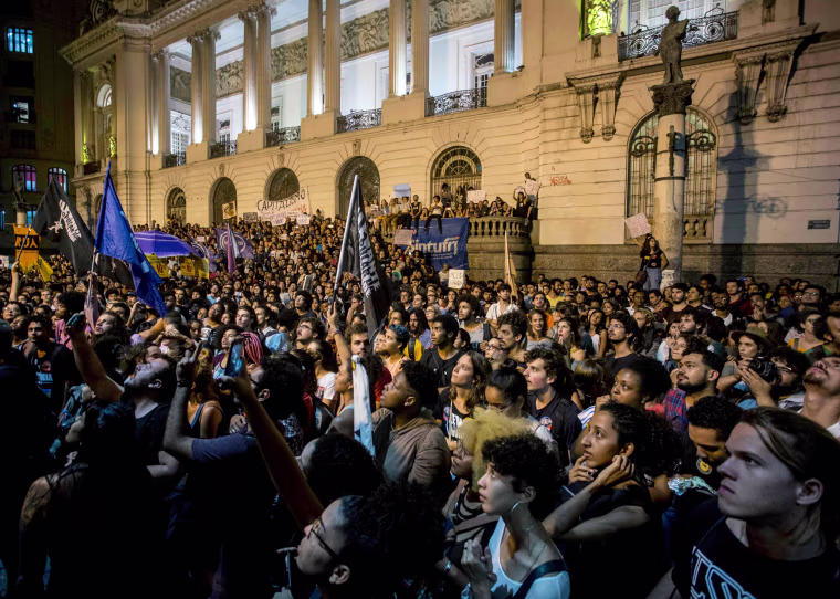 Image: Hundreds of people take part in a protest against the Brazilian government