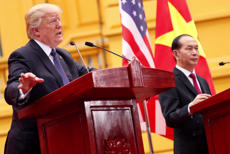 Image: Vietnam's President Tran Dai Quang and U.S. President Donald Trump address a joint news conference at the Presidential Palace in Hanoi