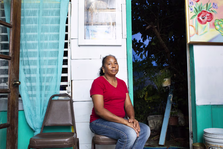 Image: Dulce Morreta-Diaz, 53, in her home at Valle Hill in Canovanas, Puerto Rico