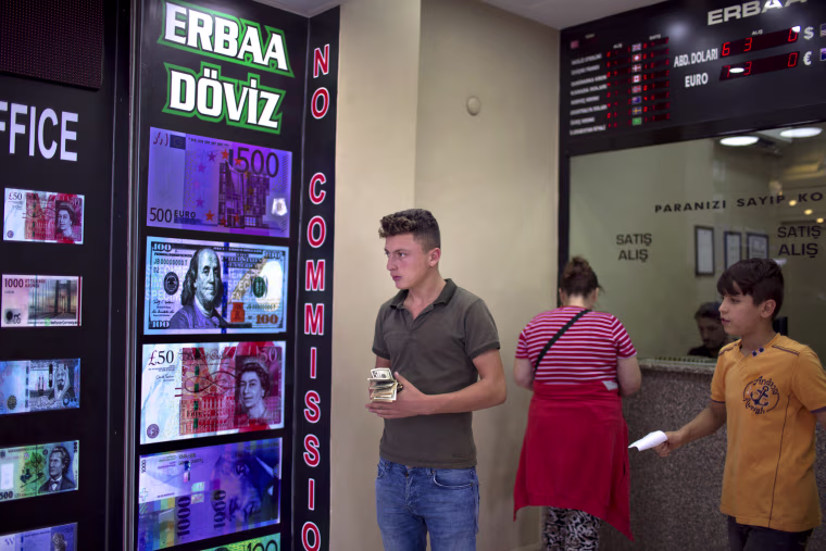 Image: Dollar exchange rates on display near Istanbul's Grand Bazaar.