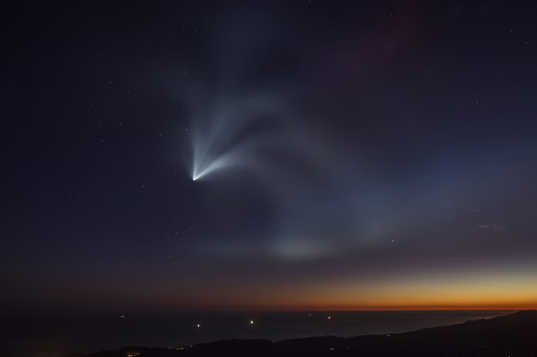 The SpaceX Falcon 9 rocket curves around the Earth and into space after launching from Vandenberg Air Force Base