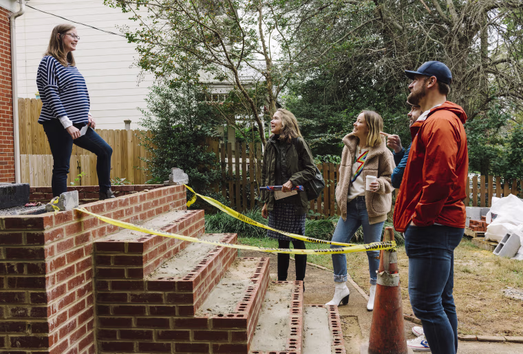 Democratic Congressional candidate, Leslie Cockburn, second left, her daughter Olivia Wilde, Jason Sudeikis and Chris Long speak with a potential voter