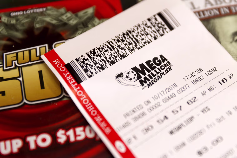 Image: A Mega Millions lottery ticket rests on the shop counter at the Street Corner Market on Oct. 17, 2018, in Cincinnati.
