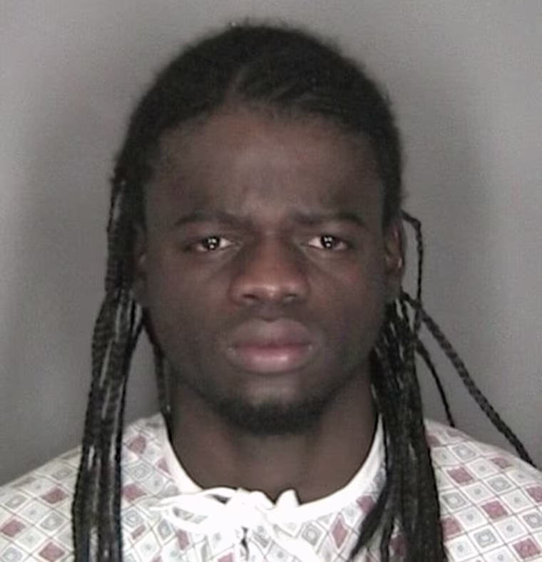Image: Murder suspect Wint is pictured in police booking photograph