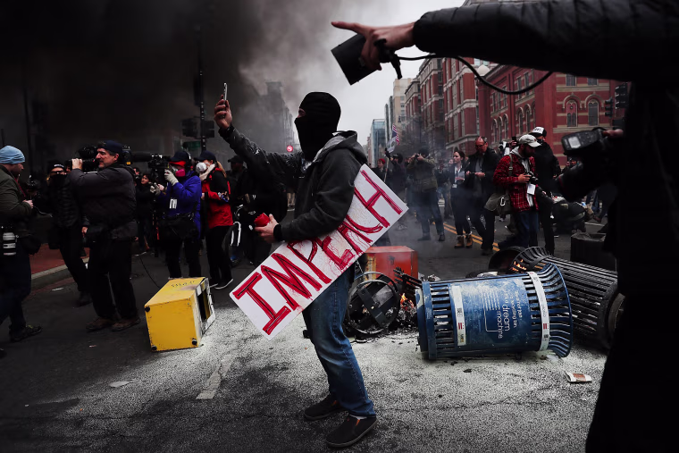 Image: Best of Year 2017: Protesters And Trump Supporters Gather In D.C. For Donald Trump Inauguration