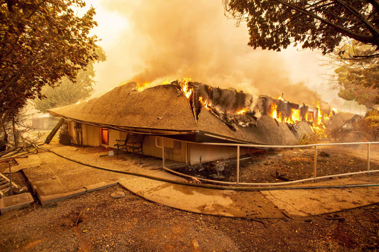 The Feather River Hospital is engulfed in flames as the Camp Fire rages through Paradise, California, on Nov. 8, 2018.