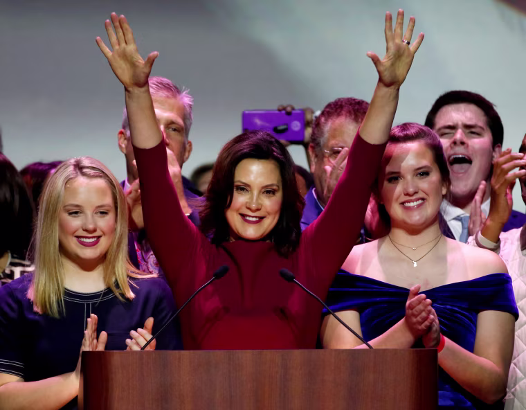 Image: FILE PHOTO: Democratic gubernatorial candidate Whitmer reacts with her daughters after declaring victory at her midterm election night party in Detroit,