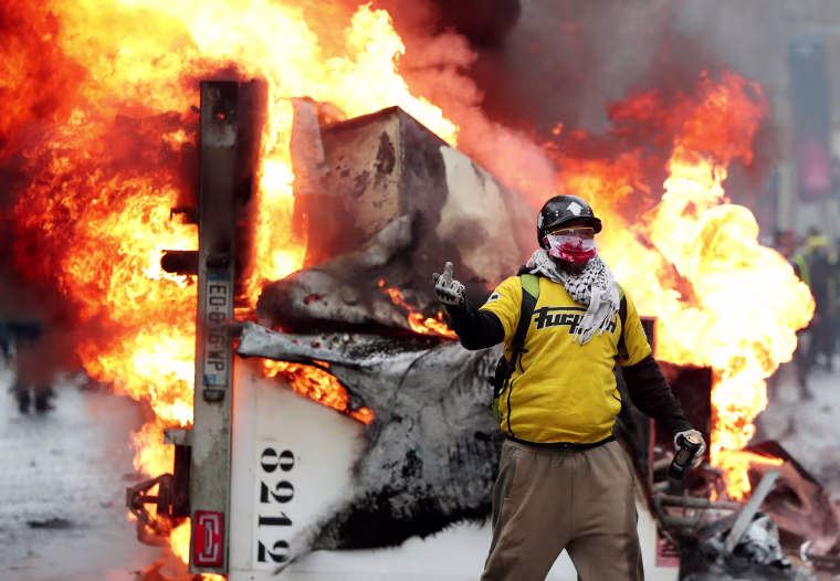 Image: A protester during clashes on the Champs-Elysees in Paris 
