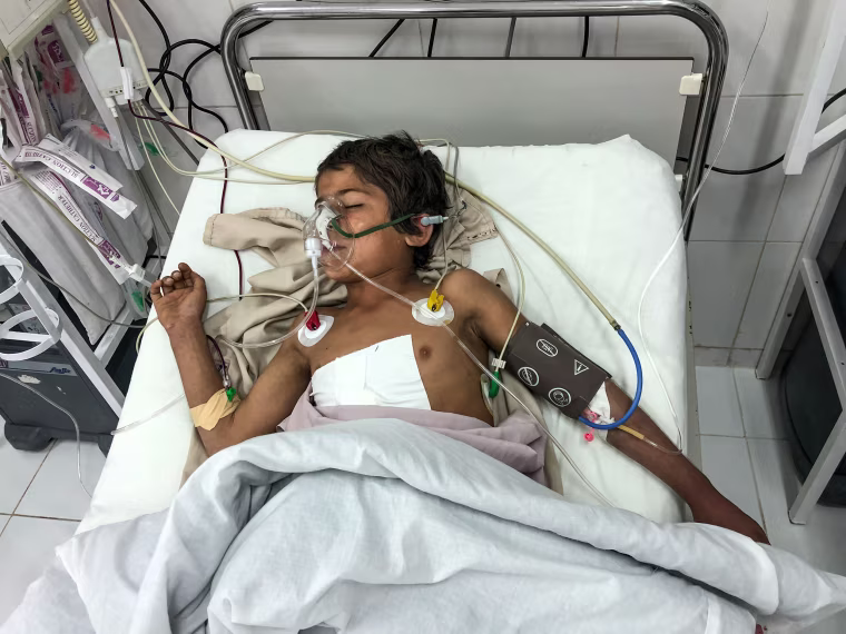 Image: Rahmatullah lies in intensive care after an operation