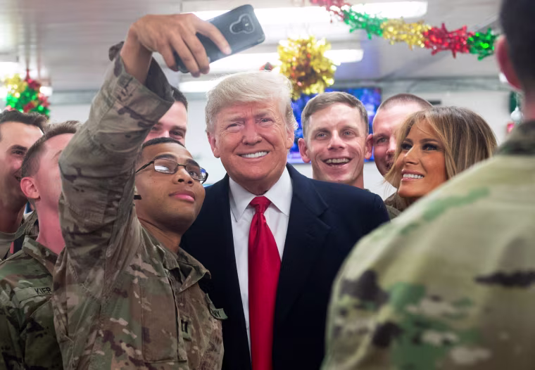 Image: President Donald Trump and First Lady Melania Trump greet members of the U.S. military during an unannounced trip to Al Asad Air Base in Iraq on Dec. 26.
