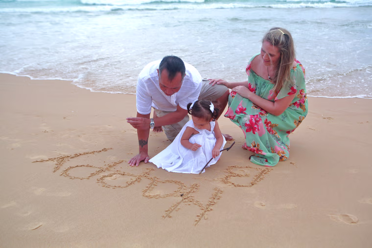 Sothy Kum with his wife, Lisa, and their daughter.
