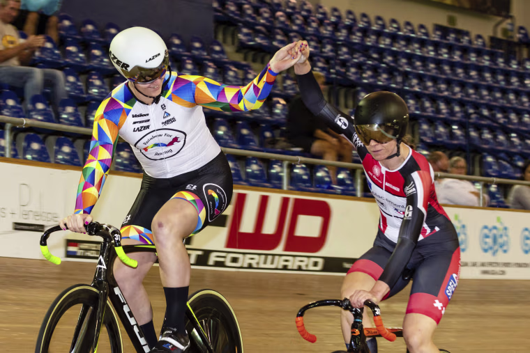 Image: Transgender cyclist Rachel McKinnon holds hands with Carolien Van Herrikhuyzen during the UCI Masters Track Cycling World Championships in Carson, California, in 2018.