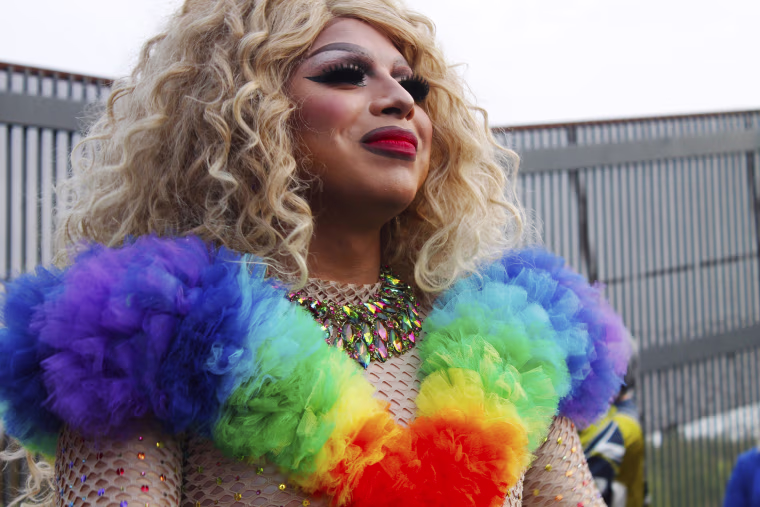 Image: Idra Valencia wears a rainbow colored outfit for her drag performance in Brownsville, Texas.