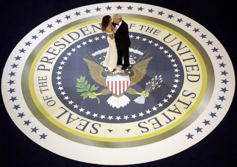 Image: President Donald Trump dances with first lady Melania Trump