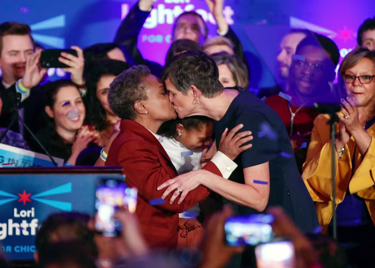 Image: Chicago mayor elect Lori Lightfoot kisses her wife, Amy Eshleman, during her election night party in Illinois on April 2, 2019.