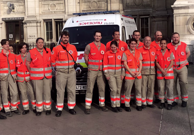 Image: Red Cross Paris members attend a ceremony with the Mayor of Paris on Thursday.