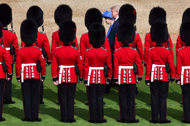 Image: Britain's Queen Elizabeth II and President Donald Trump inspect the guard of honour formed of the Coldstream Guards during a welcome ceremony at Windsor Castle in Windsor