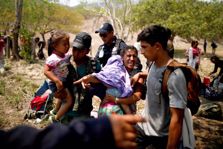 Image: A migrant family is detained by police during a raid in Pijijiapan, Mexico, on April 22, 2019.