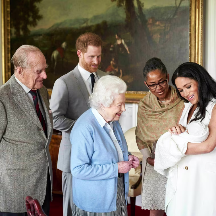 Image: Prince Harry and Meghan, Duchess of Sussex, introduce their son, Archie Harrison Mountbatten-Windsor, to Queen Elizabeth and Meghan's mother, Doria Ragland, at Windsor Castle on May 8, 2019.
